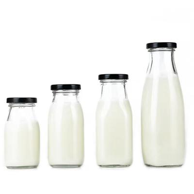 China Hot Selling Round Empty Food 200ml 250ml 500ml Glass Bottle With Lid For Milk/Juice/Tea/Drink for sale