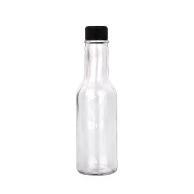 China Cheap Food BBQ Soy Sauce Glass Bottle 150ml 5oz Glass Bottle Hot Sauce With Plastic Lid for sale