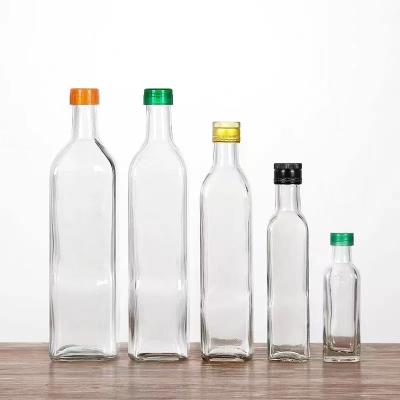 China Food 500ml 750ml High Quality Square Glass Clear Bottle With Metal Lid For Olive Oil for sale