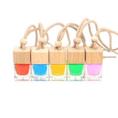 China New Design 8ml Free Samples Square Cosmetic Car Hanging Cooler Glass Air Perfume Diffuser Bottle With Wood Cap Metal Clip for sale