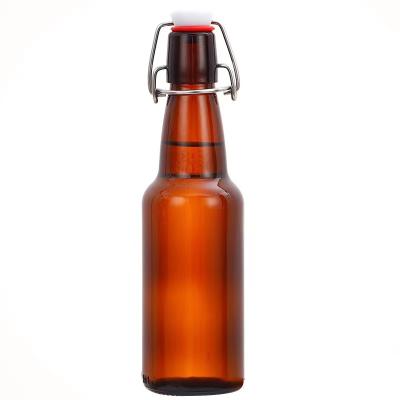 China Free Samples Beverage 12oz 16oz 32oz Amber Empty Round Glass Bottle Swing Top For Beer for sale