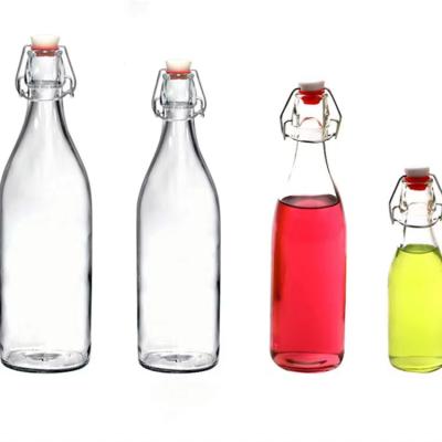 China Beverage 250ml 500ml 750ml 1000ml round shaped clear glass drink bottle with swing top cap for juice for sale