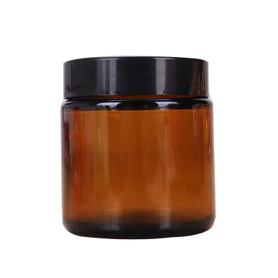 China 5g 10g 15g 20g 30g 50g Amber Glass Cream Jar With Cosmetic Luxury Black Plastic Lid For Face Cream for sale