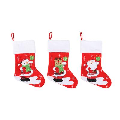 China Cheap Sublimated Christmas Stockings Snowman/Santa/Elk Christmas Stocking Holder Anti-skid moq for sale