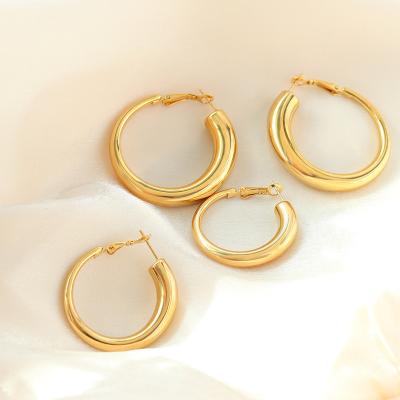 China TRENDY Minority vintage women stainless steel gold plated hollow smooth hoop earrings for sale