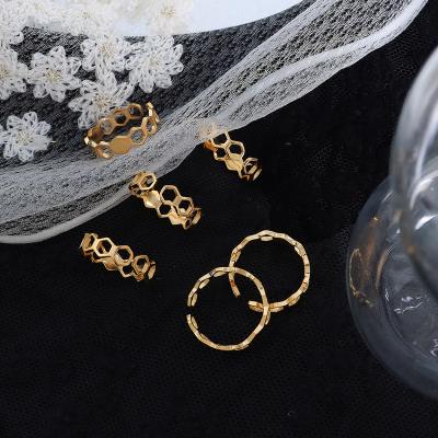 China FASHIONABLE Tasty Popular Design Honeycomb Women Hollow Out Hexagonal Stainless Steel Gold Plated Ring for sale