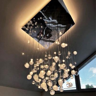 China 2021 Modern Transparent Glass Ball Chandelier Creative Lighting Colorful Glass Ball Staircase Chandelier for sale