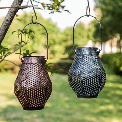 China Garden Round Holes Solar Metal Garden Lights Retro Lantern Hollow Light Hanging Solar Lantern With Handle for sale