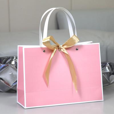 China Guangdong Recyclable Eco Friendly Holographic Polka Dot Cardboard Washable Fruit Protection Blush Pink Paper Bag for sale