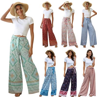 China Anti-wrinkle 2021 Plus Size Boho Bandage Wide Leg Pants Tropical Floral Plus Size Women Long Trousers for sale