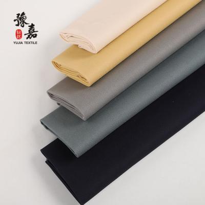 China Cotton Stretch Twill Fabric Mens Pants Anti-Static Cotton Fabric With Carbon Peach for sale