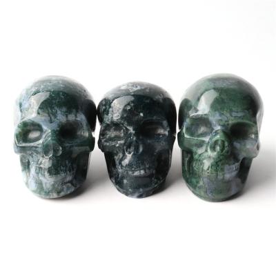 China China Hand Carved Natural Crystal Skulls Halloween People Open Moss Agate Skulls For Decoration for sale