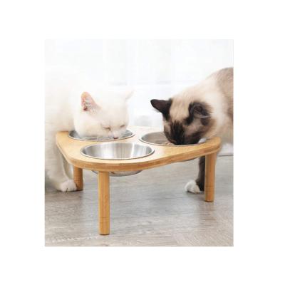 China Sustainable Elevated Cat Bowl With Bamboo Stand 3 Stainless Steel Bowls Non Slip Removable Feet for sale