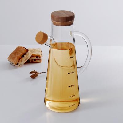 China Seal Factory Price 650ml Olive Oil And Vinegar Glass Bottle With Bamboo Stopper Lid for sale