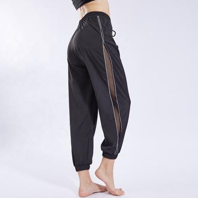 China Custom Made Gym Anti-UV Workout Clothing Breathable Mesh Side Pants Wholesale Women Joggers for sale