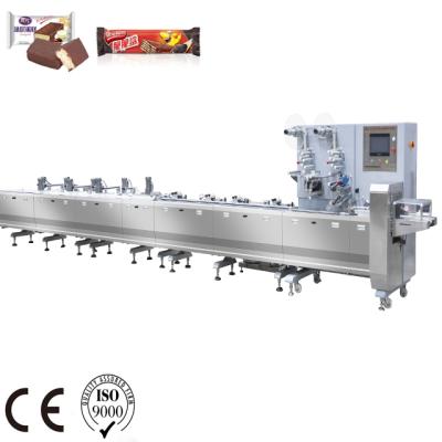 China Horizontal Type Flow Packet Peanut Nougat Bar Packing Machine CLOTHING Belt Synchronous Transmission Pillow Machine USD for sale