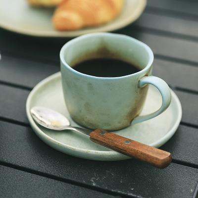 China Japanese Style Sustainable Tea Cup With Saucer Reactive Rust Stoneware Cup And Saucer for sale