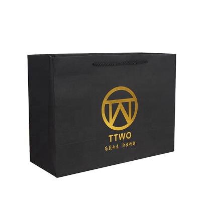 China Recyclable Luxury Biodegradable Packaging Can Customize Its Own Logo Gold Plated Black Kraft Paper Gift Bag With Rope Handle for sale