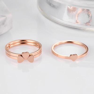 China FASHIONABLE combination of clovers 18k rose gold ring titanium steel cold style heart shaped ring for women wholesale for sale