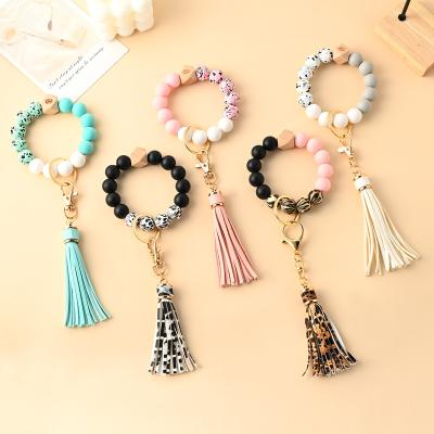 China CLASSIC Custom Silicone Beads Elastic Wristband Bracelet Key Chain Tassel Leather Silicone Beads Wristband Bracelet Key Chain for sale