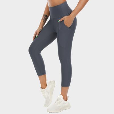 China Breathable High Waist Yoga Pants With Pockets Tummy Control Leggings Workout Seamless Stretch Yoga Leggings for sale