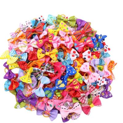 China Stocked Cute Puppy Dog Small Bowknot Hair Bows with Rubber Bands Handmade Hair Accessories Bow Pet Grooming Products for sale