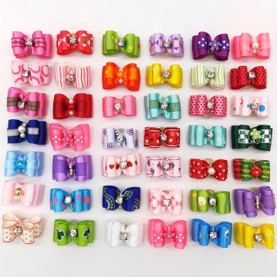 China Stocked Yorkie Puppy Dog Hair Bows with Rubber Bands Rhinestone Handmade Pet Small Hair Bowknot Grooming Accessories for sale