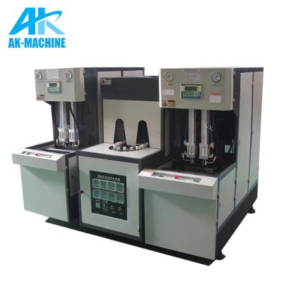 China AK-32 small bottle blow molding machine with 2 head machine set for 2 cavity plastic bottle making machine for sale