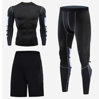 China 3 Piece Match Breathable Gym Compression Tights Men's Sportswear Freestyle Fitness Clothing for sale