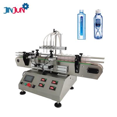 China Food JINJUN Automatic Small Pump Liquid Water Bottle Filling Machine Magnetic Liquid Filling Production Line Desktop Four Head Small for sale