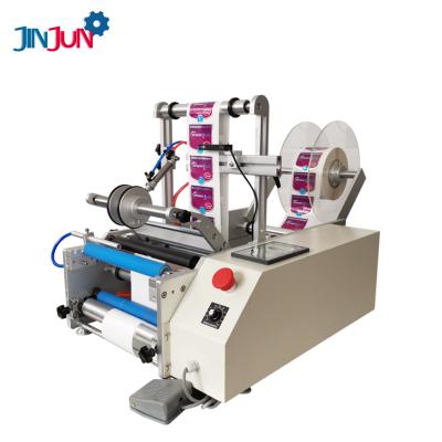 China JINJUN Food semi-automatic double-sided sticker labeling machine for round glass plastic bottle for sale