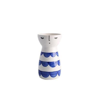 China Morden Eco-friendly Ceramic Wholesale Ceramic Simple Design Flower Vase Human Face White Vase For Home Decor for sale