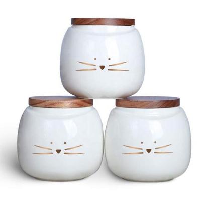 China Sustainable Ceramic Cat Food Storage Jar With Bamboo Lid Kitchen Canister for sale