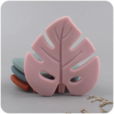 중국 Molar Infant Chew Toys Leaf Shape Food Grade Silicone Baby Teether 판매용