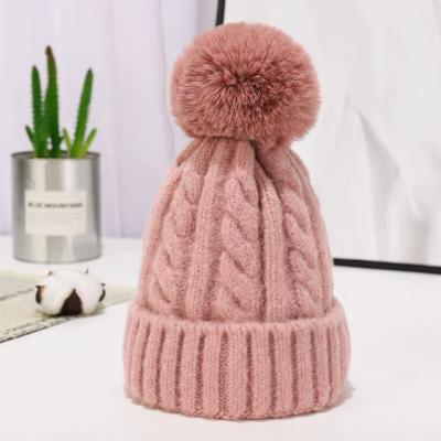 China COMMON Wholesale Fur Balls Hat Fashion Warm Winter Knitted Woman's Winter Hats With Pom Pom for sale