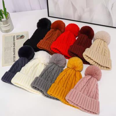 China COMMON Wholesale Fur Balls Hat Fashion Warm Winter Knitted Fox Fur Balls Beanie Pom Pom Girls Hat With Fur Women for sale