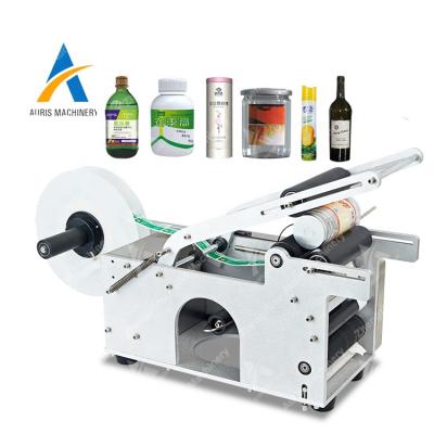 China Single bottle glass table automatic round sleeve water wine sticker box jar operation labeling machine for round bottle for sale