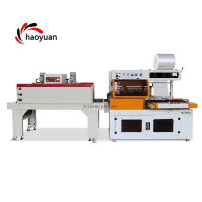 China HAOYUAN FQL-450 Automatic Food Cosmetics Ear Phone Boxes Book Food Shoes Heat PP POF Wrapping Film Shrink Packaging Machine for sale