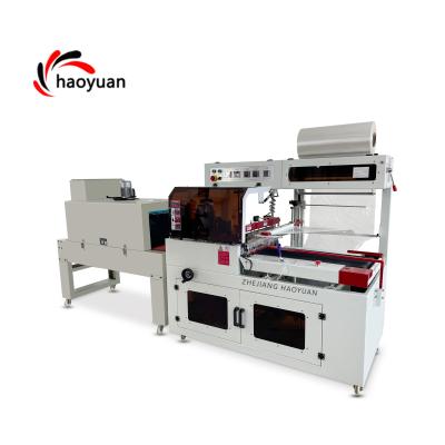 China Automatic Plastic Machine Side Wrap Food HYBF Shrink Paper Wrapping Sealing Machine for sale