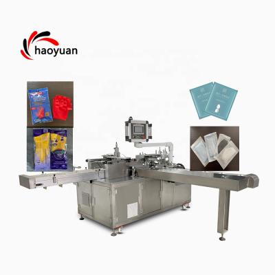 China HY-100 HAOYUAN Full Automatic Food Medicine Sachet Board Kitchen Towell Latex Glove Packing Machin Machine for sale