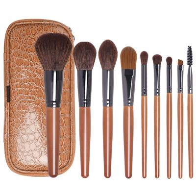 China Angular Blush Anzini 9pcs High quality spot wholesale fiber hair wooden handle cosmetic brushes with bag for Beginners and professionals for sale