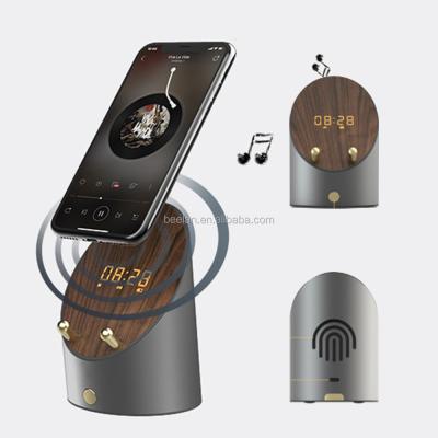 China New Induction Digital Clock Loudspeaker Blue Tooth Call Loudspeaker Video Wooden Loud Mobile Phone Smart Holders for sale