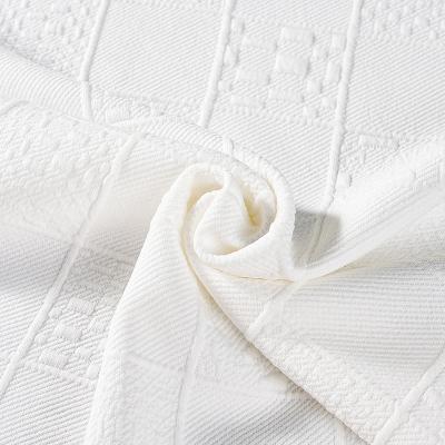 China Abrasion-Resistant Factory customized 225gsm white 100% polyester brocade jacquard knit fabric for clothing for sale