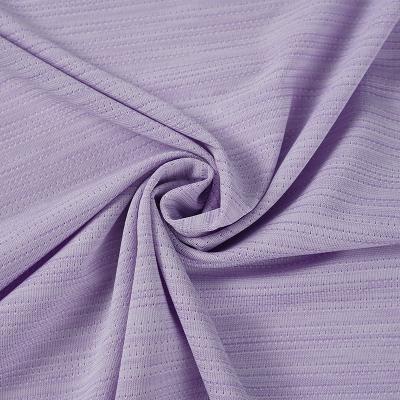 China Wicking Size hole jacquard mesh cloth 150g polyester warp knitted mesh fabric sportswear quick dry yoga clothing fabric for sale