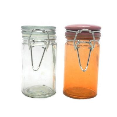 China Sustainable Airtight Mini Cylinder Glass Spice Jar With Metal Clip Top for sale