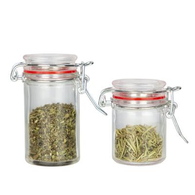 China Freshness Preservation 50ML 80ML Round Mini Small Glass Jar With Lid Locking Clip for sale