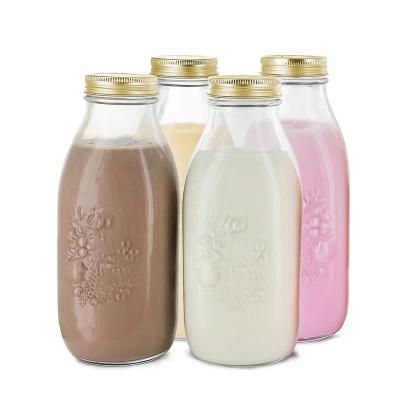 China Freshness Preservation 1000ml Dairy Reusable Glass Milk Bottles With Metal Lids for sale