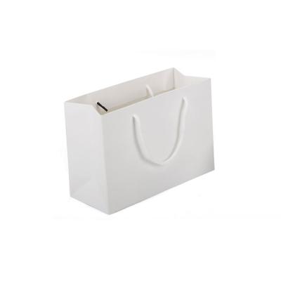 China Microwavable Custom Logo Thickened White Kraft Paper Tote Bag With Handle Luxury Clothes Gifts Snack Bags for sale