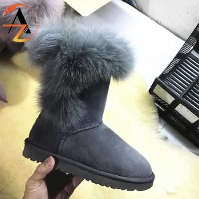 China Fashion trend anti slip waterproof women snow furry boots 2020 winter fox fur boots girls lady big boots for sale