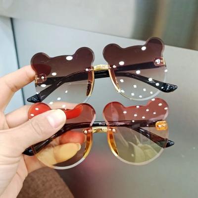 China Resin 2022 Summer UV Protection Cat Ear Children Sunglasses Frameless Chain Exposure Shape Cute High View Glass Sun Shades for sale